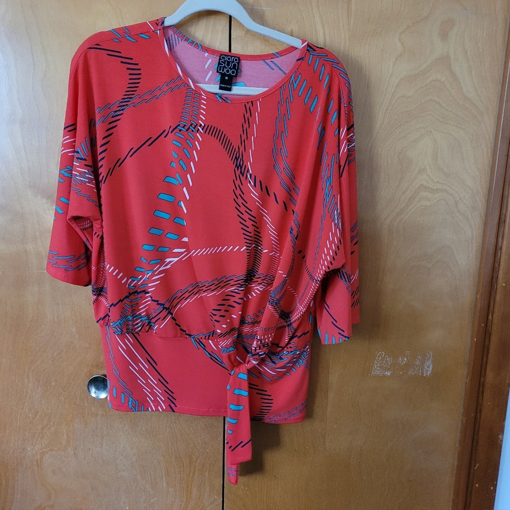 ClARA SUN WOO. Orange Women's Top , Abstract Design. 3/4 length Dolman Sleeve